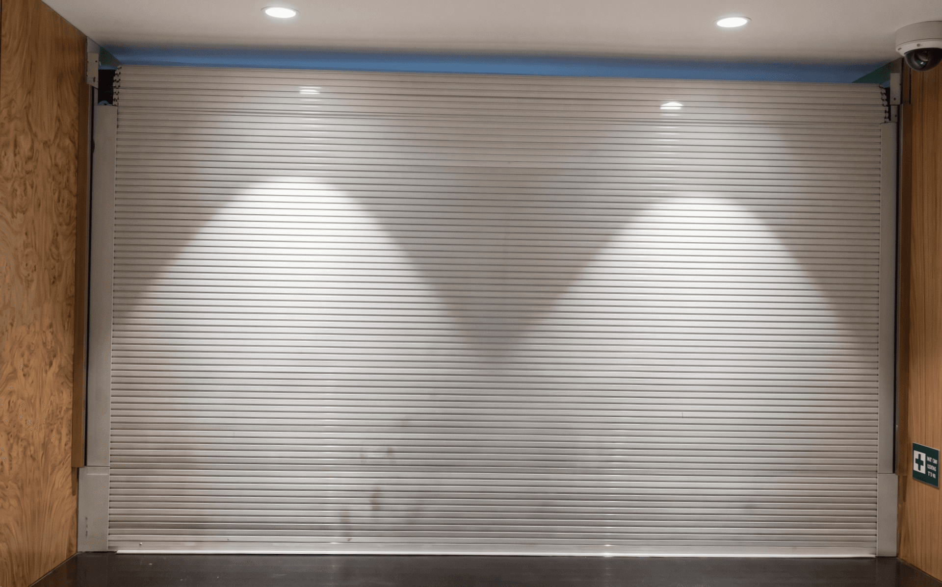 minimalist modern automated gates for a high-end commercial property with concrete and metal accents